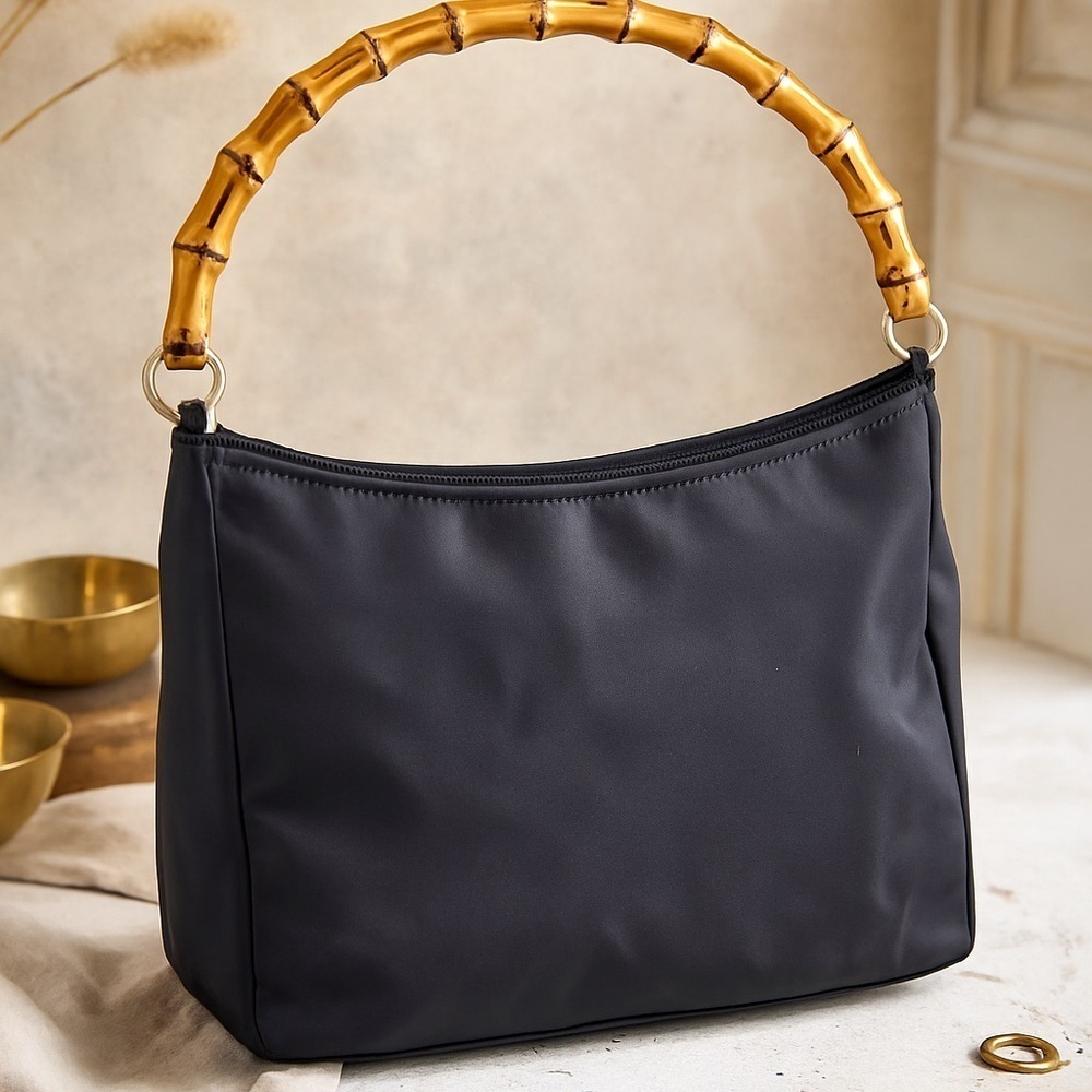 Black Nylon Bamboo-Handle Shoulder Bag

Chic, vintage-inspired black nylon